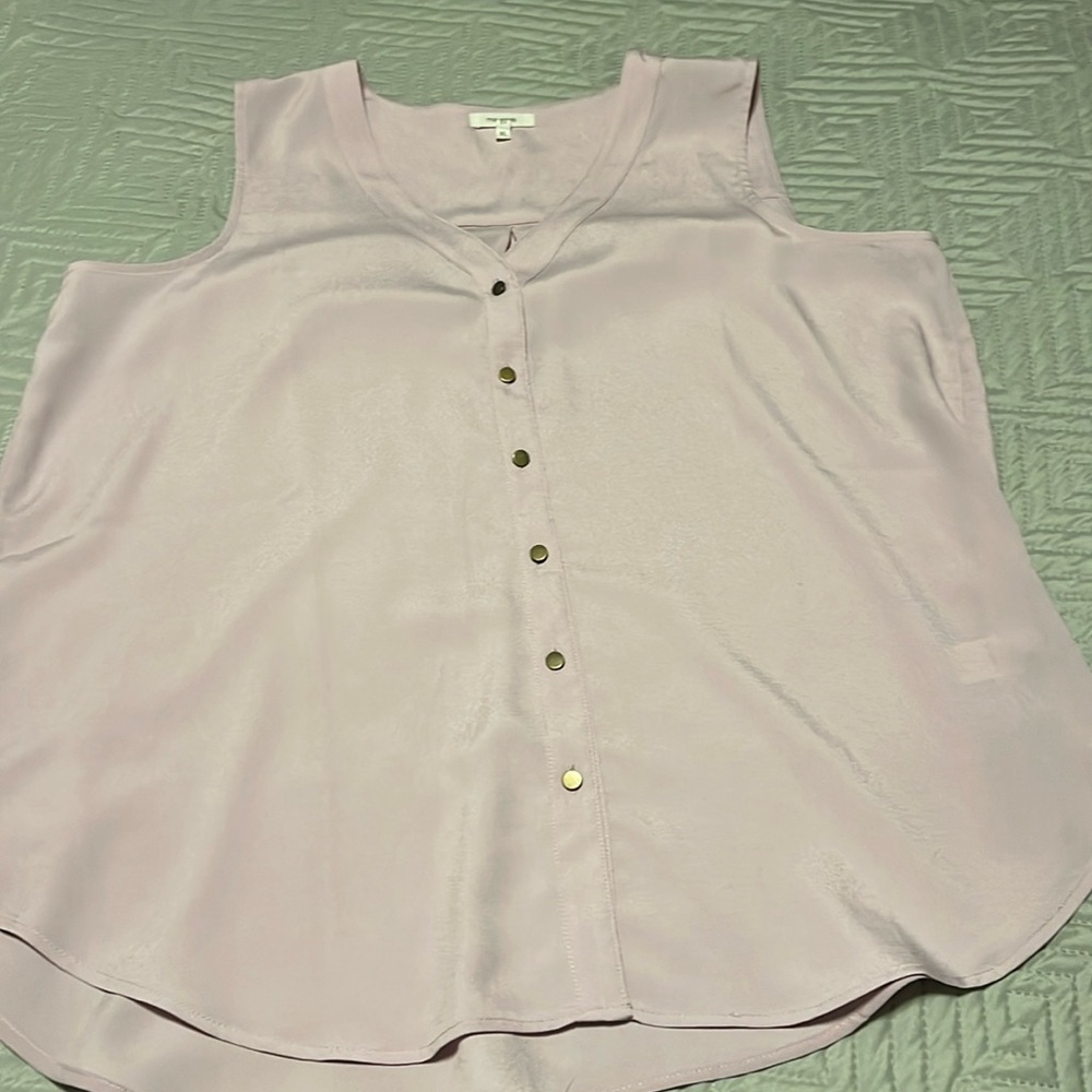 Pink blouse size extra large by Maurices.  Button down front sleeveless design